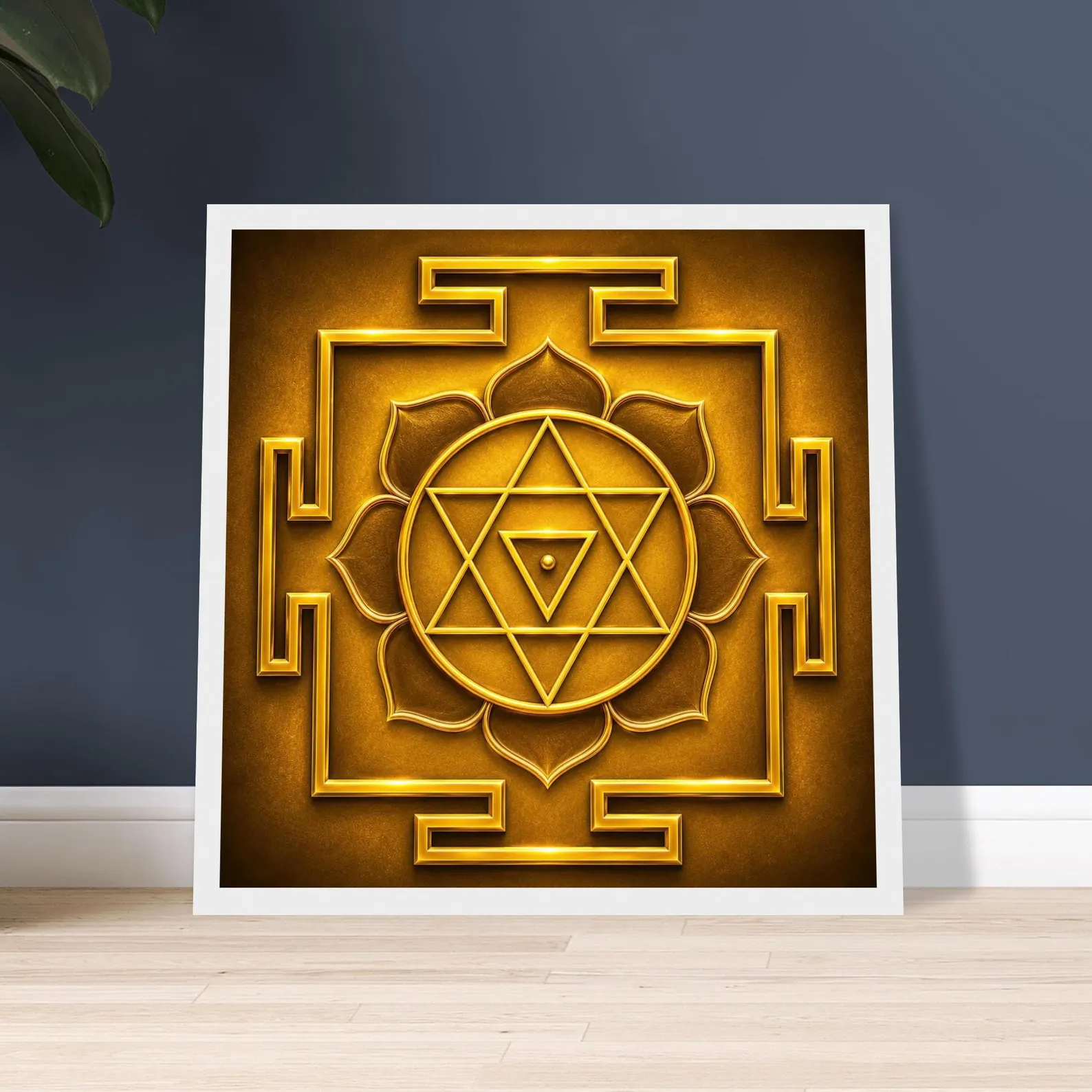 Bagalamukhi Yantra print in a white square frame leaning against a dark blue wall